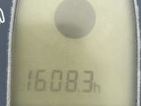 a close up of a calculator with a clock on it