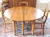 an image of a dining table and chairs in a room
