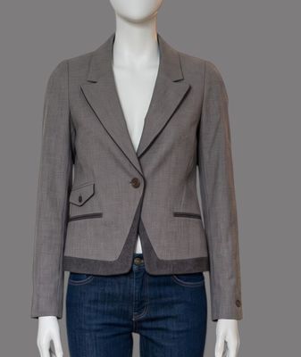 a woman ' s gray jacket and jeans on a mannequin mannequin mannequin mannequin mannequin mannequin mannequin mann