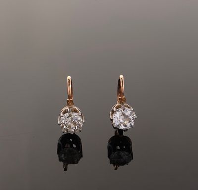 an image of a pair of diamond and gold earrings