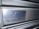 a close up of a silver oven with the door open