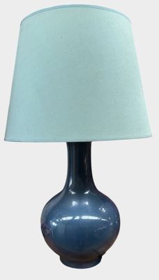 a blue table lamp with a blue shade on it
