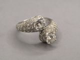 an image of a close up of a diamond ring on a table