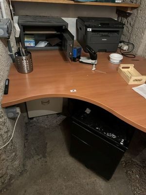a computer desk with a printer and a printer on it