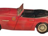 an image of a red toy car on a white background