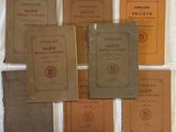 several old books on a table with a white background