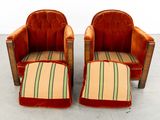 pair of orange velvet lounge chairs with matching foot stools