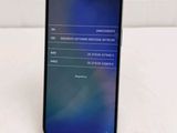 the back of a black samsung s9 phone with a display on the screen
