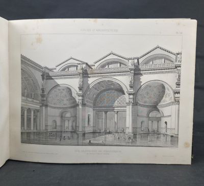 an open book with a drawing of a building inside of it