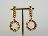 a pair of gold tone earrings with a twisted design