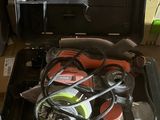 a tool case with a helmet and other tools in it