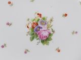 a white plate with a floral design on it