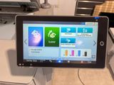 a tablet that is sitting on top of a printer
