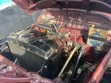 a red car with a radiator and a radiator in it