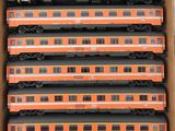 a lot of train cars in a box on the table