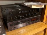 a dvd player sitting on top of a shelf next to a cd player