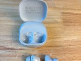 a pair of ear buds sitting in a case on a table