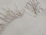 a close up of a piece of cloth with a fringe