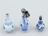 three vases that are sitting next to each other on a table