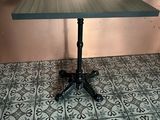 a table that is sitting on top of a tile floor