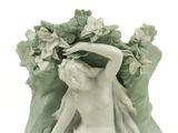 a figurine of a woman with flowers on her head