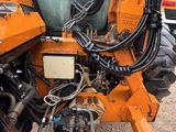 an image of a tractor with a backhoe attached to it ' s back
