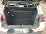 the back of a car with its trunk open and the back of the car with its luggage in the trunk