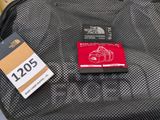 a luggage bag with a tag on it and a tag attached to it