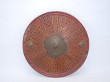 a picture of a red plate on a white wall