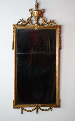Miroir Louis XVI en bois doré. H : 135 cm, l : 61 cm