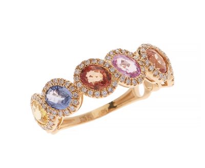 a gold ring with multi colored stones and diamonds