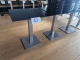 a black table with a price tag on it in a store