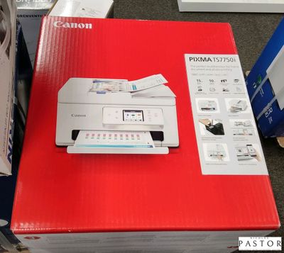 une imprimante Canon posée sur une boîte rouge