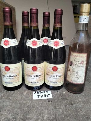 several bottles of wine are lined up on a table
