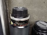 a camera and a lens sitting next to each other
