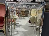 a mirror that is sitting on a table in a room