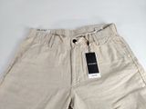 a close up of a pair of khaki shorts with a tag on it