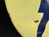 a yellow surfboard with a picture of a woman on it