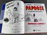 an open book with a drawing of a man holding a gun