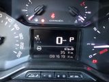 a close up of a car ' s dashboard with a digital display