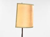 a lamp that is on a table with a lamp shade on it