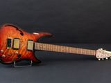 an electric guitar sitting on a stand on a black surface