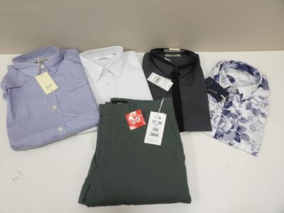 a lot of men ' s shirts and pants on a table