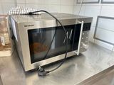 a microwave that is sitting on a counter in a kitchen