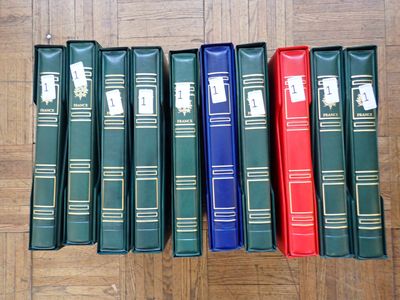 books lined up in a row on a wooden floor