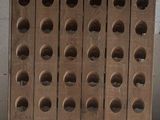 a stack of wooden crates with holes on them