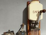a small coffee grinder and a small coffee grinder next to each other