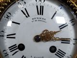 a clock with roman numerals on the face of it