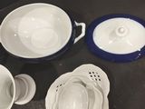 many bowls and pans sitting on a table