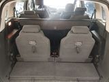 two seats in the back of a car with the back seats folded down